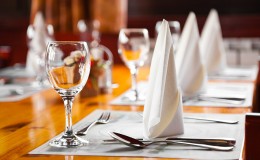 Glasses and plates on table in restaurant